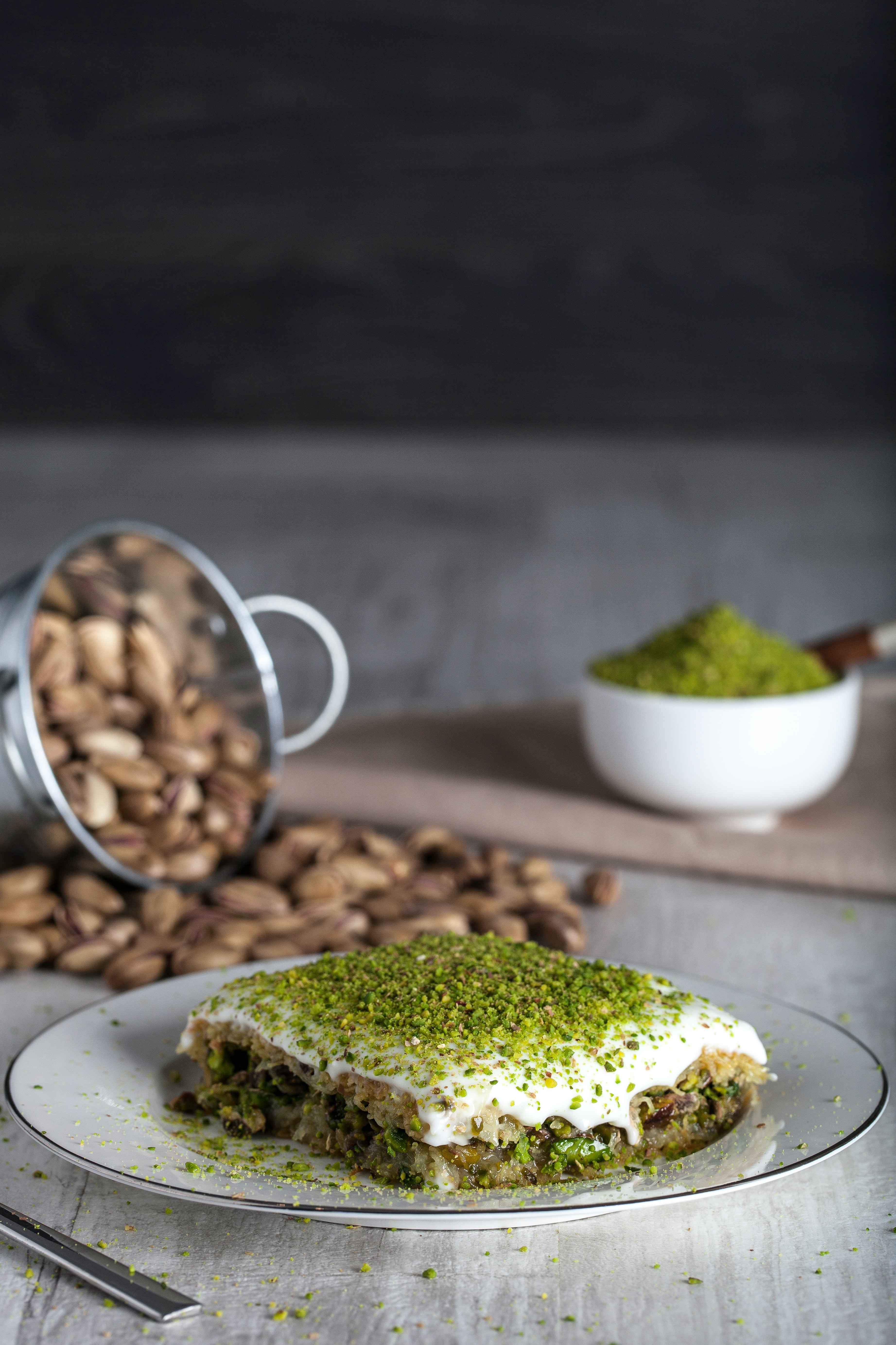 Pistachio Kadayif on white ceramic plate